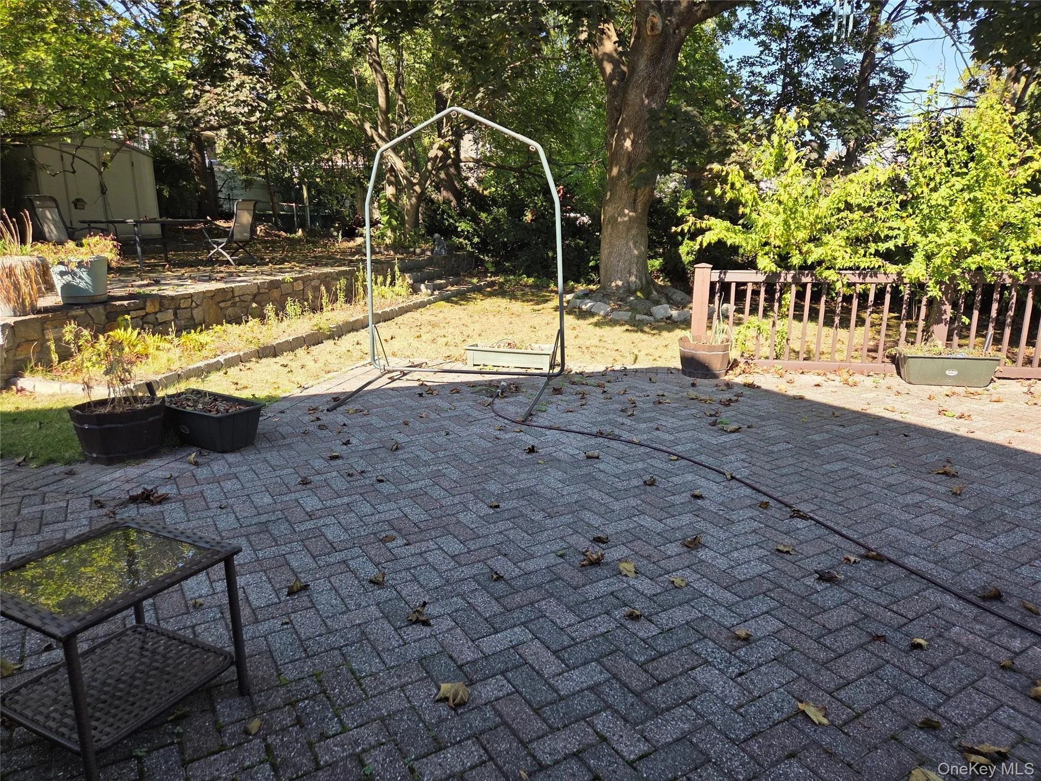 View of patio featuring view of scattered trees View of patio featuring view of scattered trees