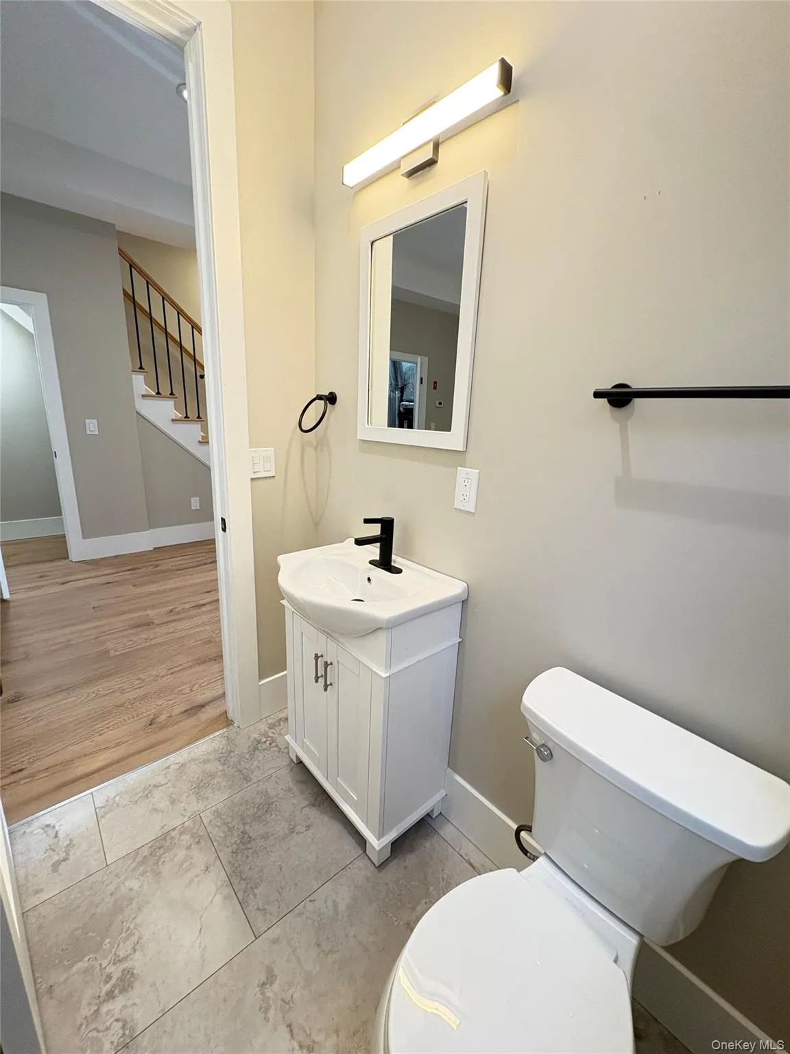 Bathroom with vanity and light tile patterned floors Bathroom with vanity and light tile patterned floors
