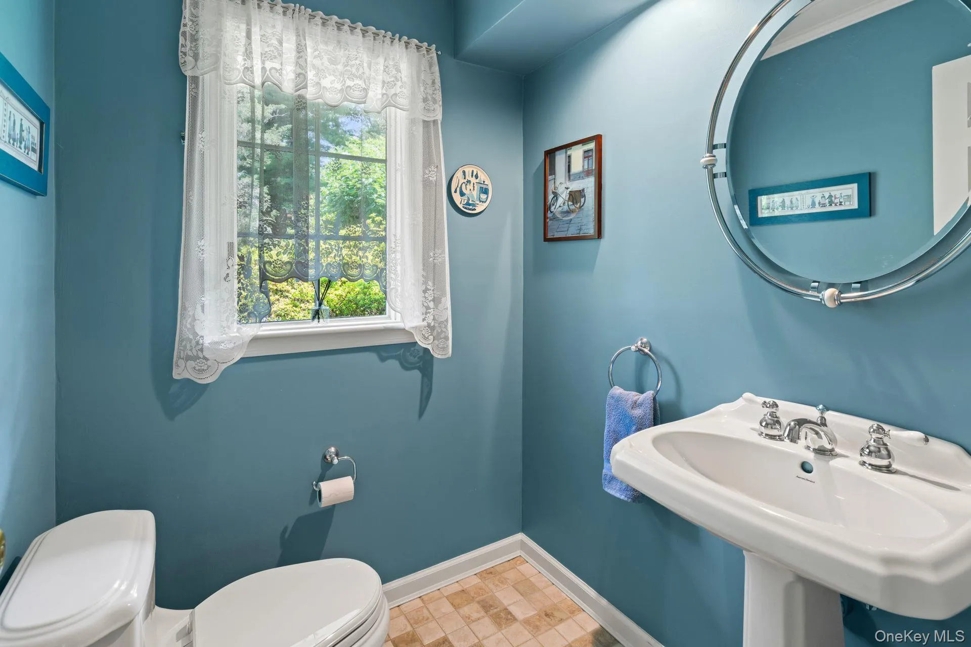 Half bathroom with toilet and baseboards Half bathroom with toilet and baseboards