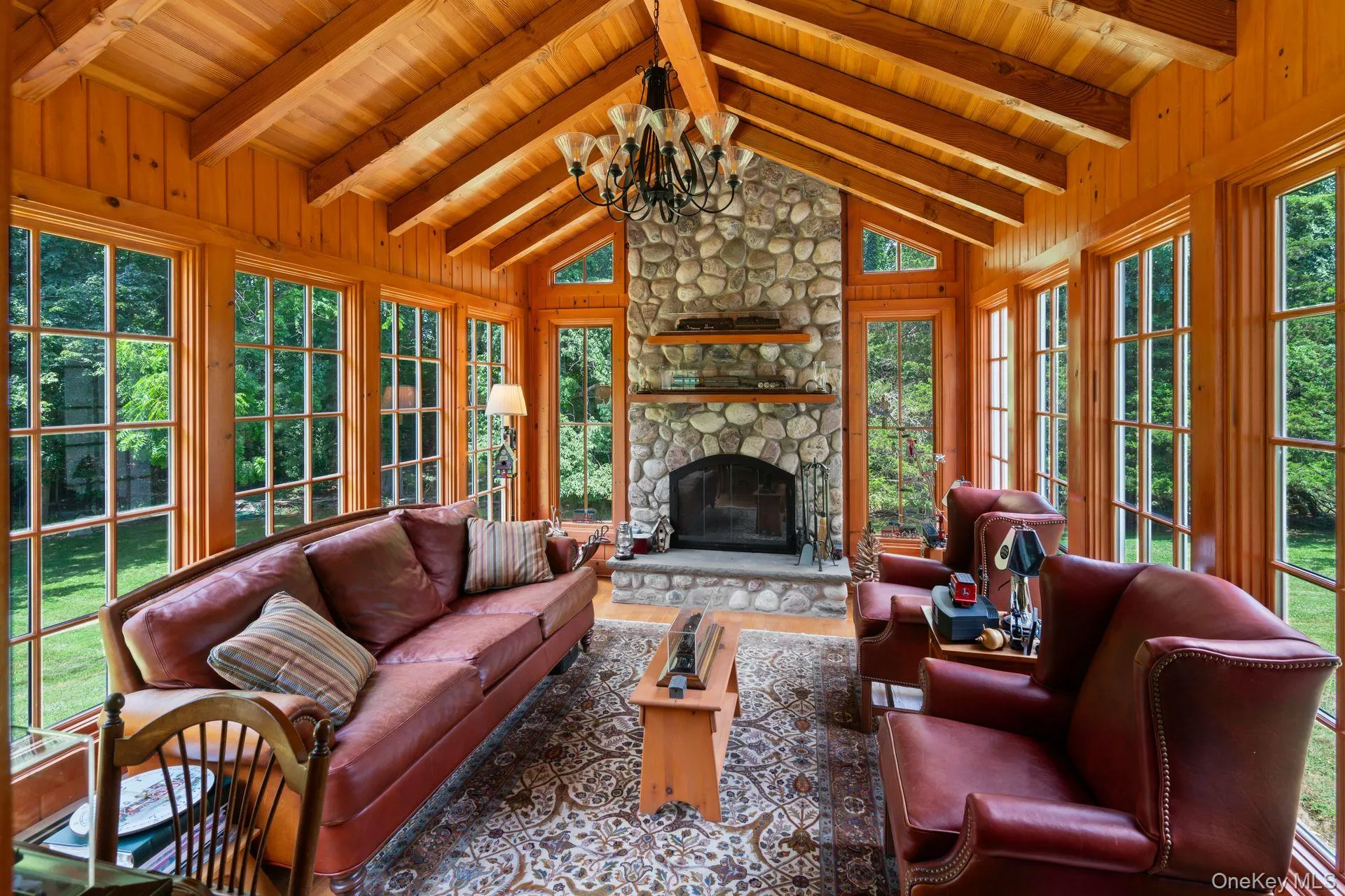 Sunroom featuring a chandelier and french doors Sunroom featuring a chandelier and french doors