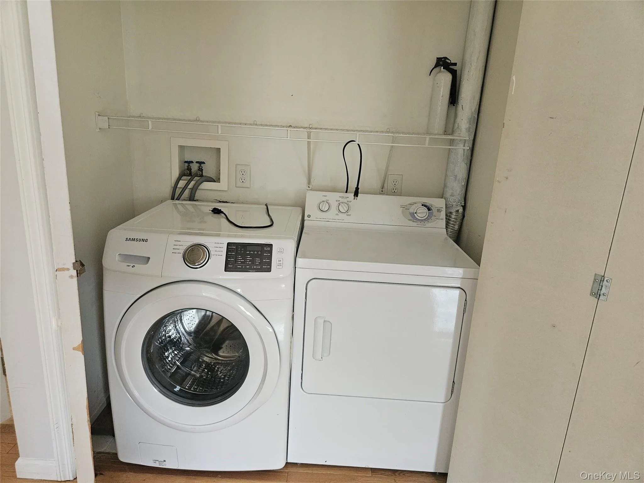Laundry area with washer and clothes dryer Laundry area with washer and clothes dryer