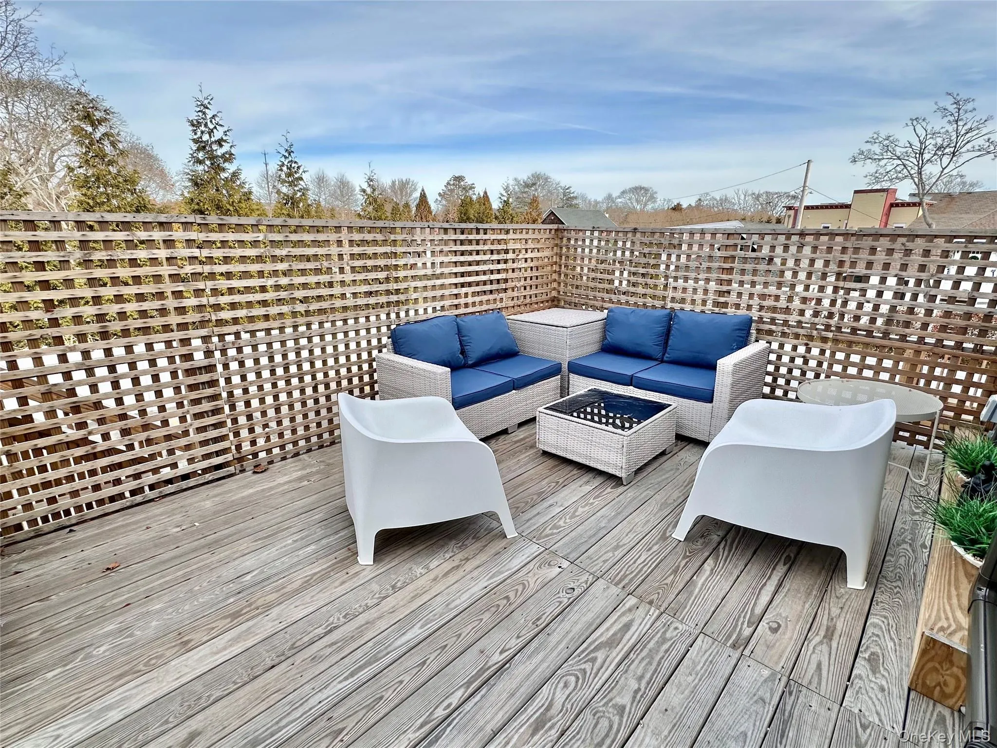 Deck with an outdoor living space with a fire pit Deck with an outdoor living space with a fire pit