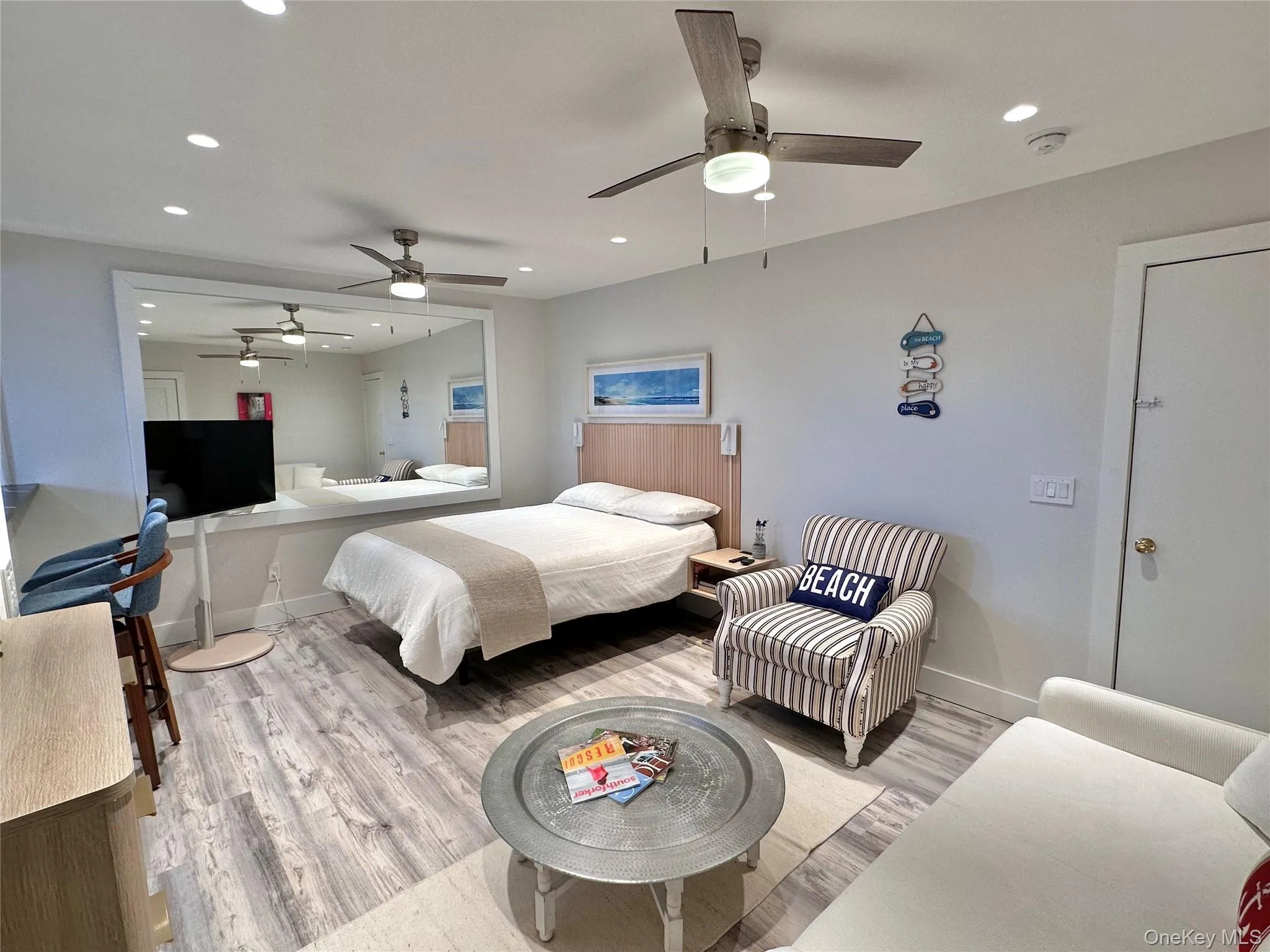 Bedroom with light wood-style flooring, recessed lighting, and a ceiling fan Bedroom with light wood-style flooring, recessed lighting, and a ceiling fan