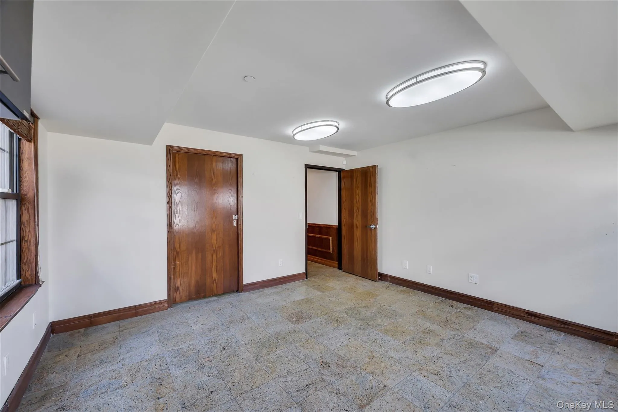 Unfurnished bedroom featuring baseboards Unfurnished bedroom featuring baseboards