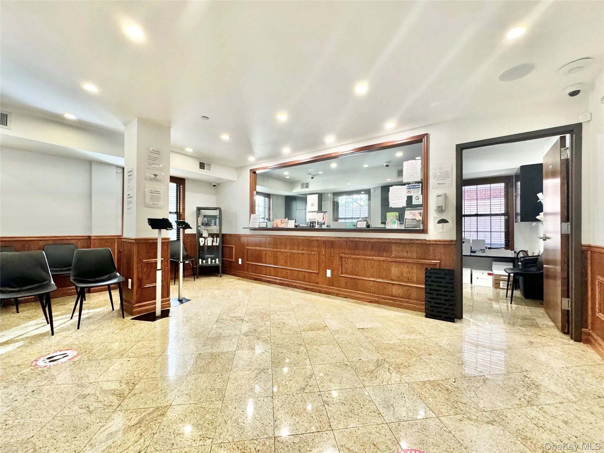 Welcome area with a wainscoted wall, wood walls, and recessed lighting Welcome area with a wainscoted wall, wood walls, and recessed lighting