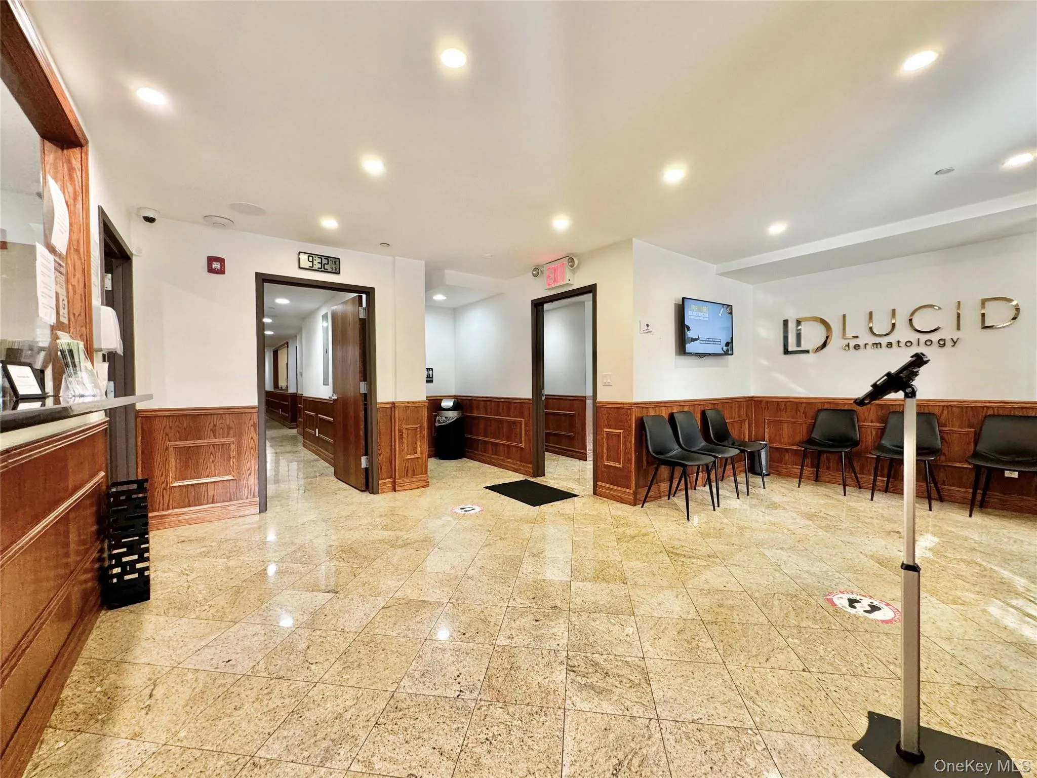 Welcome area featuring recessed lighting and wainscoting Welcome area featuring recessed lighting and wainscoting