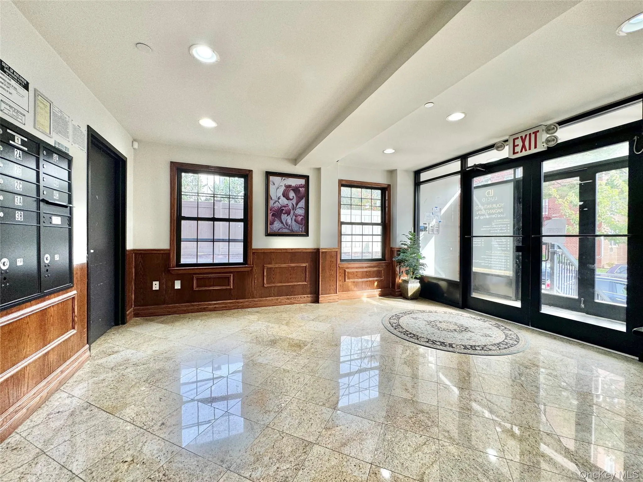 Common area featuring recessed lighting and a wainscoted wall Common area featuring recessed lighting and a wainscoted wall