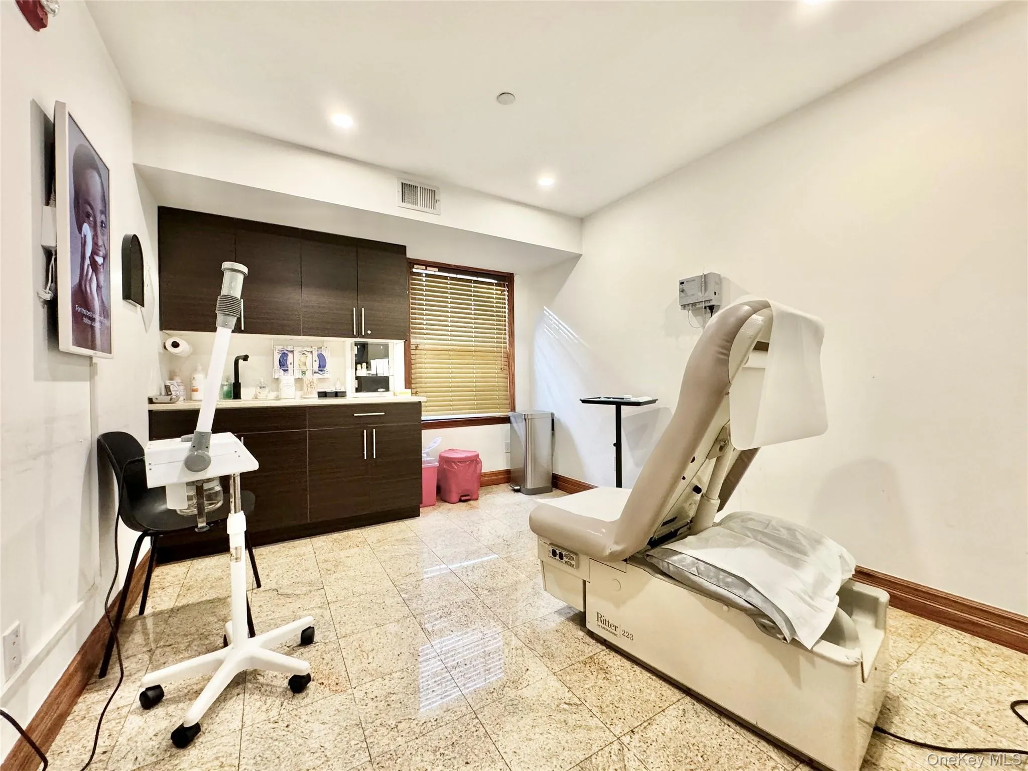 Living area with baseboards and recessed lighting Living area with baseboards and recessed lighting