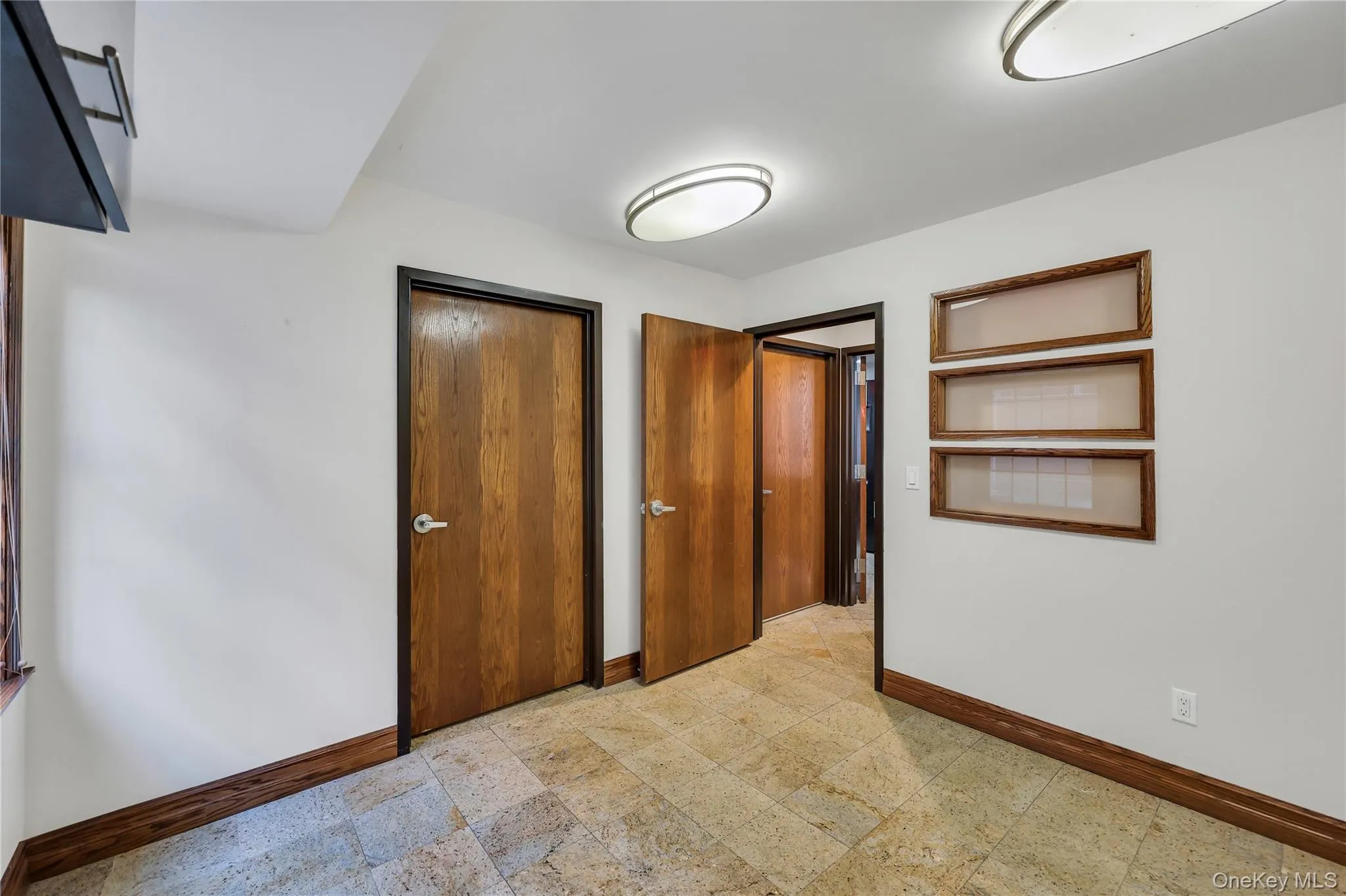 Unfurnished bedroom featuring baseboards and a closet Unfurnished bedroom featuring baseboards and a closet