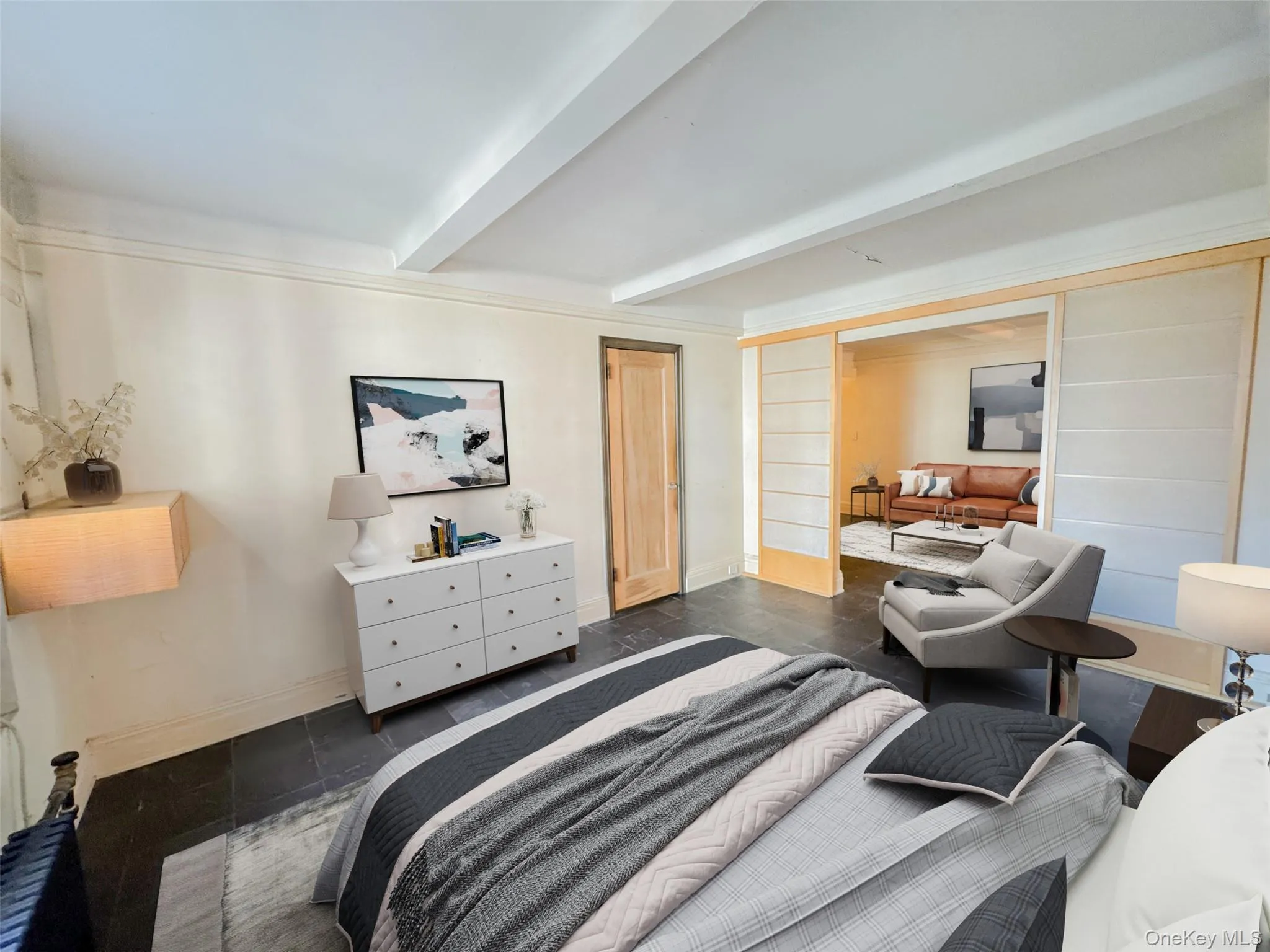 Bedroom featuring beam ceiling and a closet Bedroom featuring beam ceiling and a closet