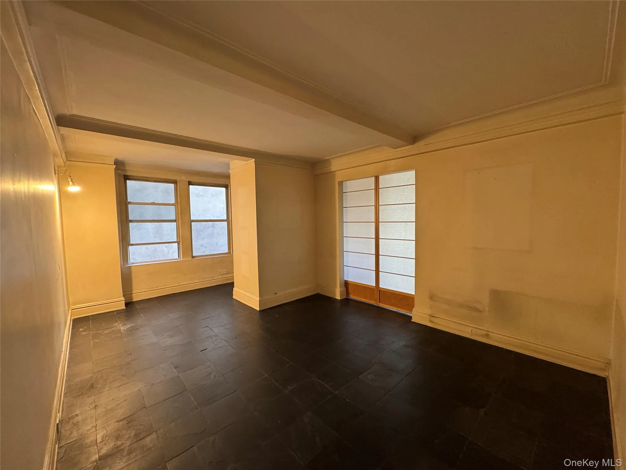 Spare room featuring beam ceiling and ornamental molding Spare room featuring beam ceiling and ornamental molding