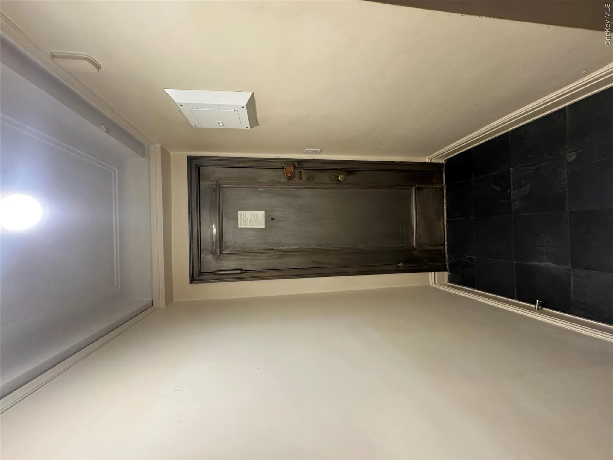 Doorway to outside with baseboards and tile patterned floors Doorway to outside with baseboards and tile patterned floors