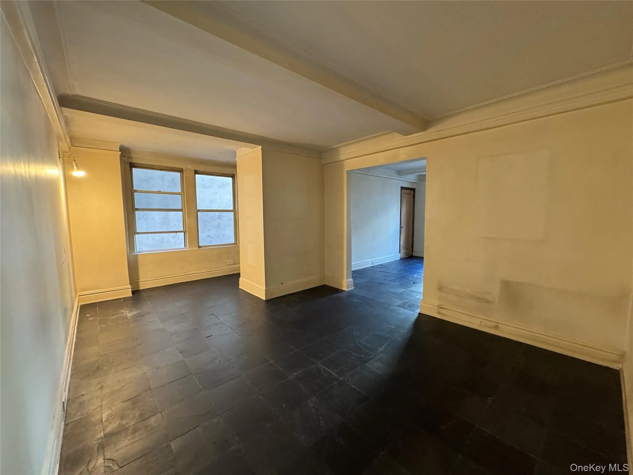 Spare room with crown molding and beamed ceiling Spare room with crown molding and beamed ceiling