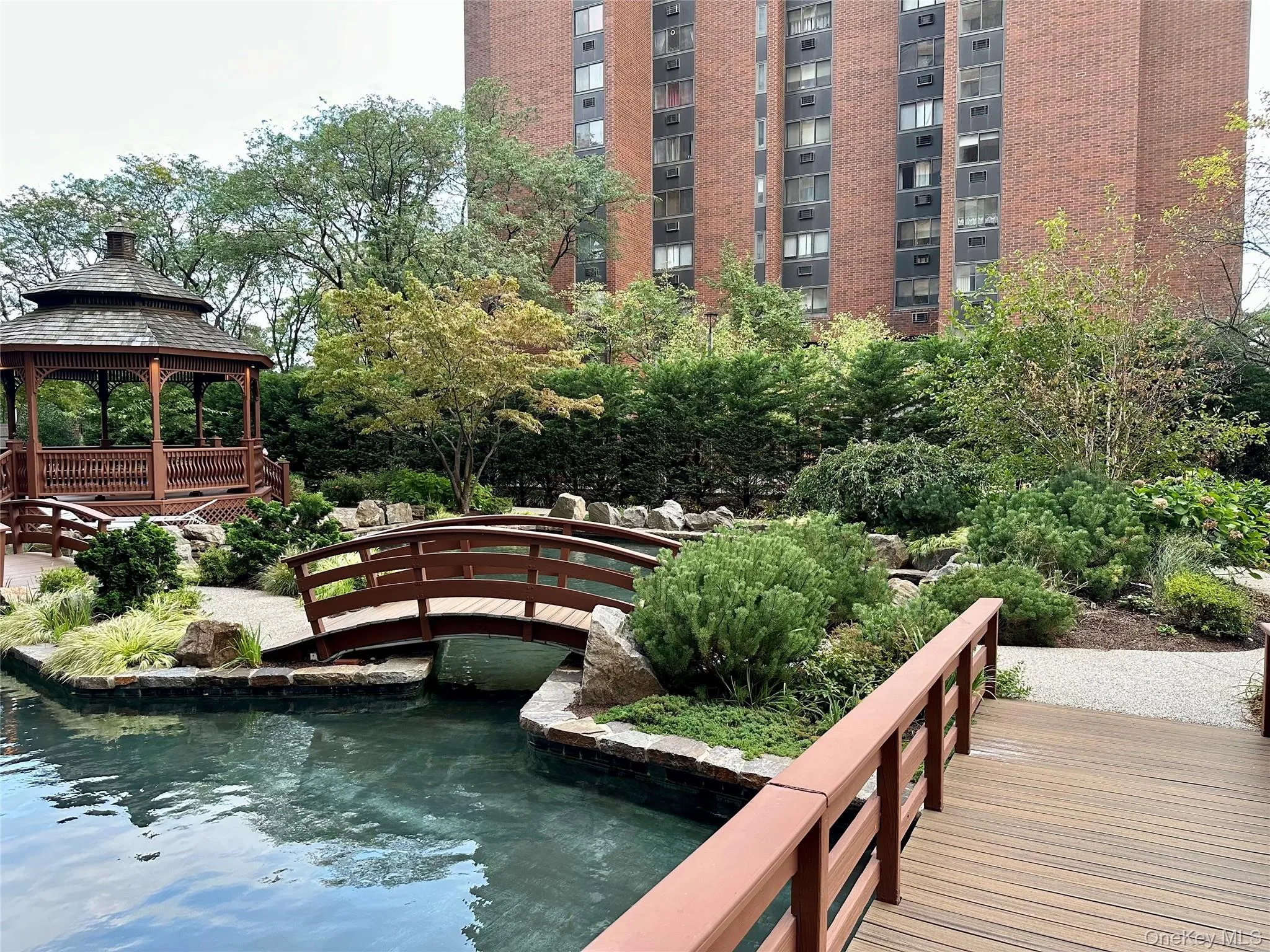 View of water feature with a bridge and gazebo View of water feature with a bridge and gazebo