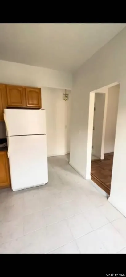 Spare room featuring light tile patterned flooring Spare room featuring light tile patterned flooring