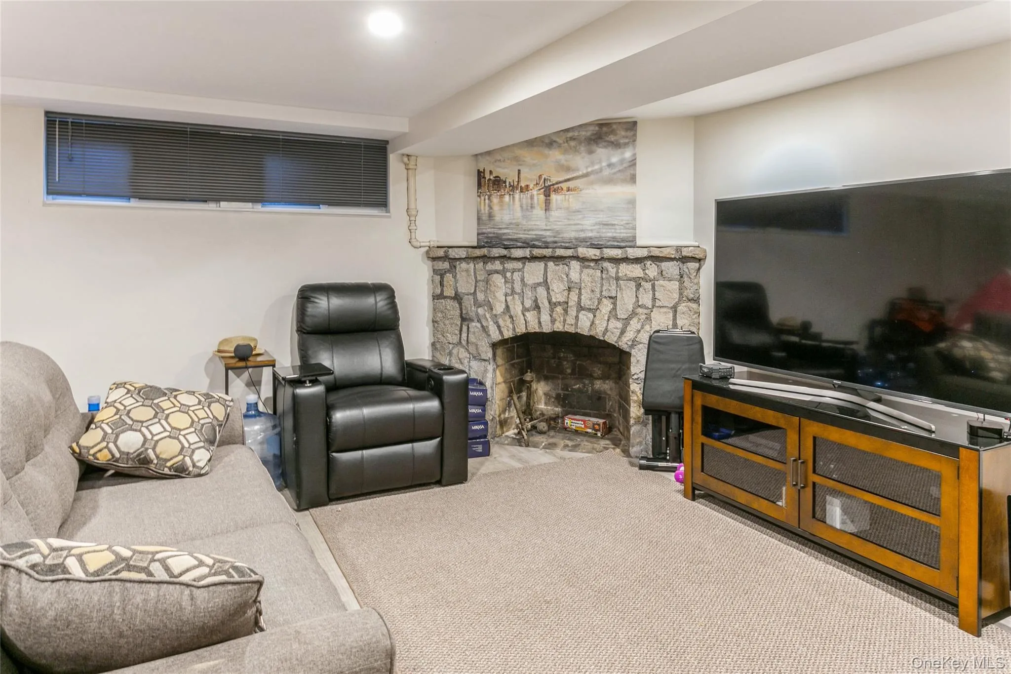 Carpeted living area with a fireplace Carpeted living area with a fireplace