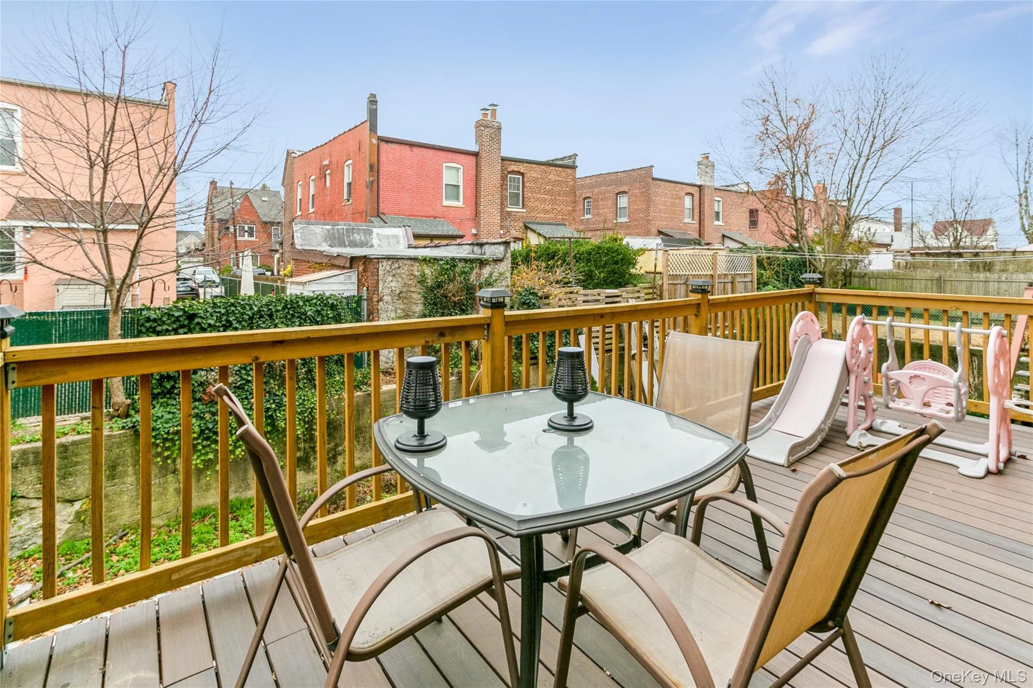 Deck with outdoor dining space and a residential view Deck with outdoor dining space and a residential view