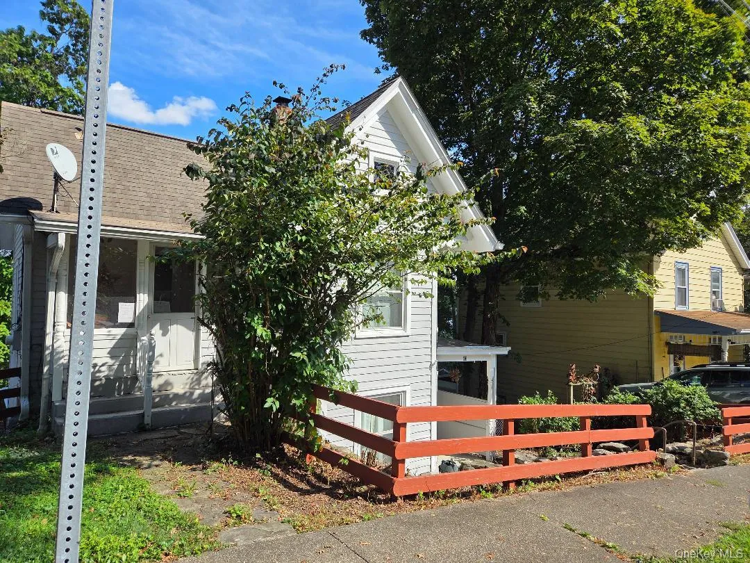 View of side of property featuring. roof with shingles View of side of property featuring. roof with shingles