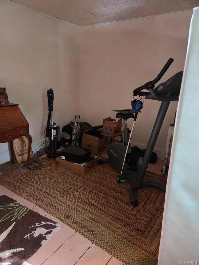 Exercise area with crown molding Exercise area with crown molding