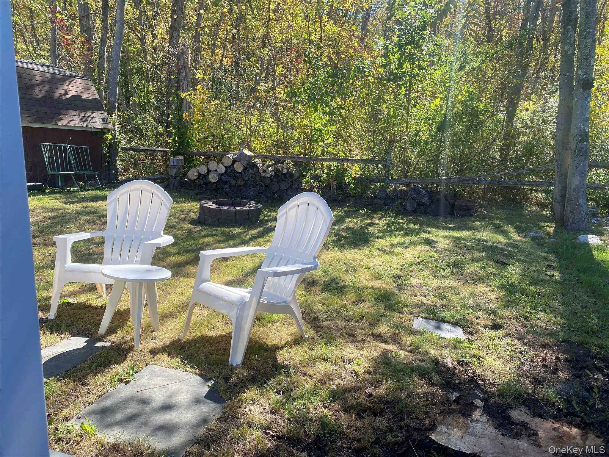 View of yard featuring a fire pit View of yard featuring a fire pit