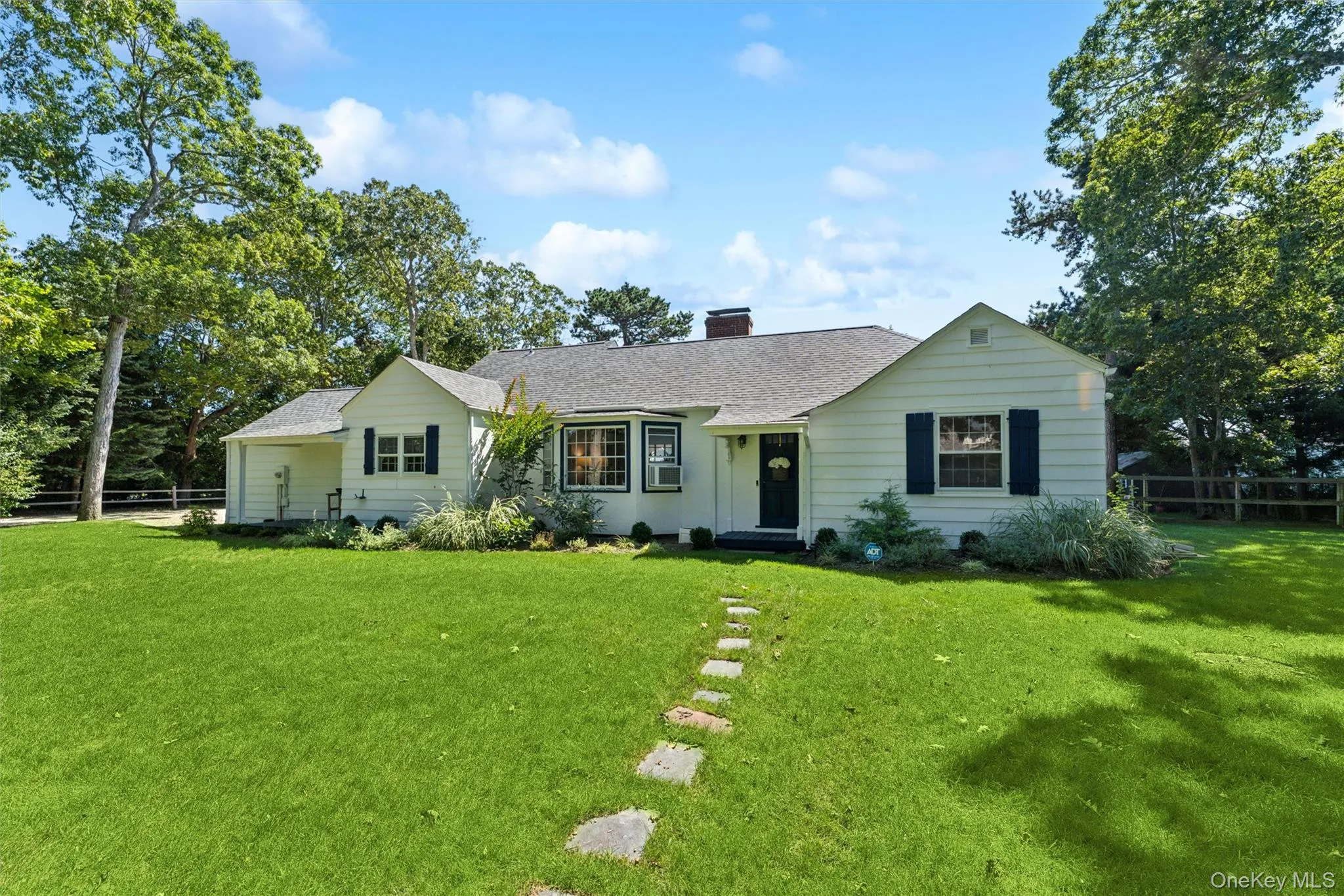 Ranch-style home with a chimney, a shingled roof, and cooling unit Ranch-style home with a chimney, a shingled roof, and cooling unit