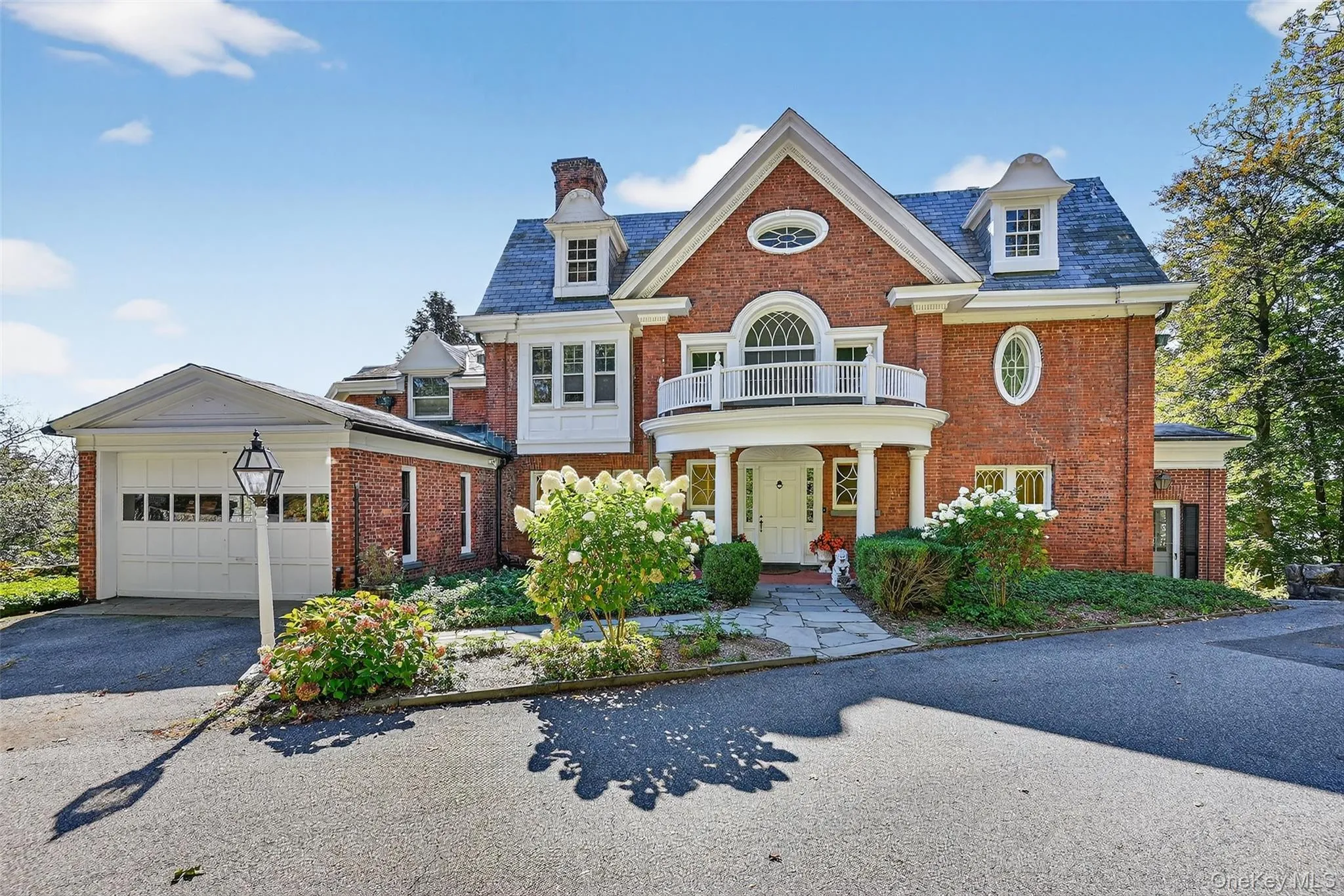 Front facade, with covered portico, garage and bluestone entry walk. Front facade, with covered portico, garage and bluestone entry walk.
