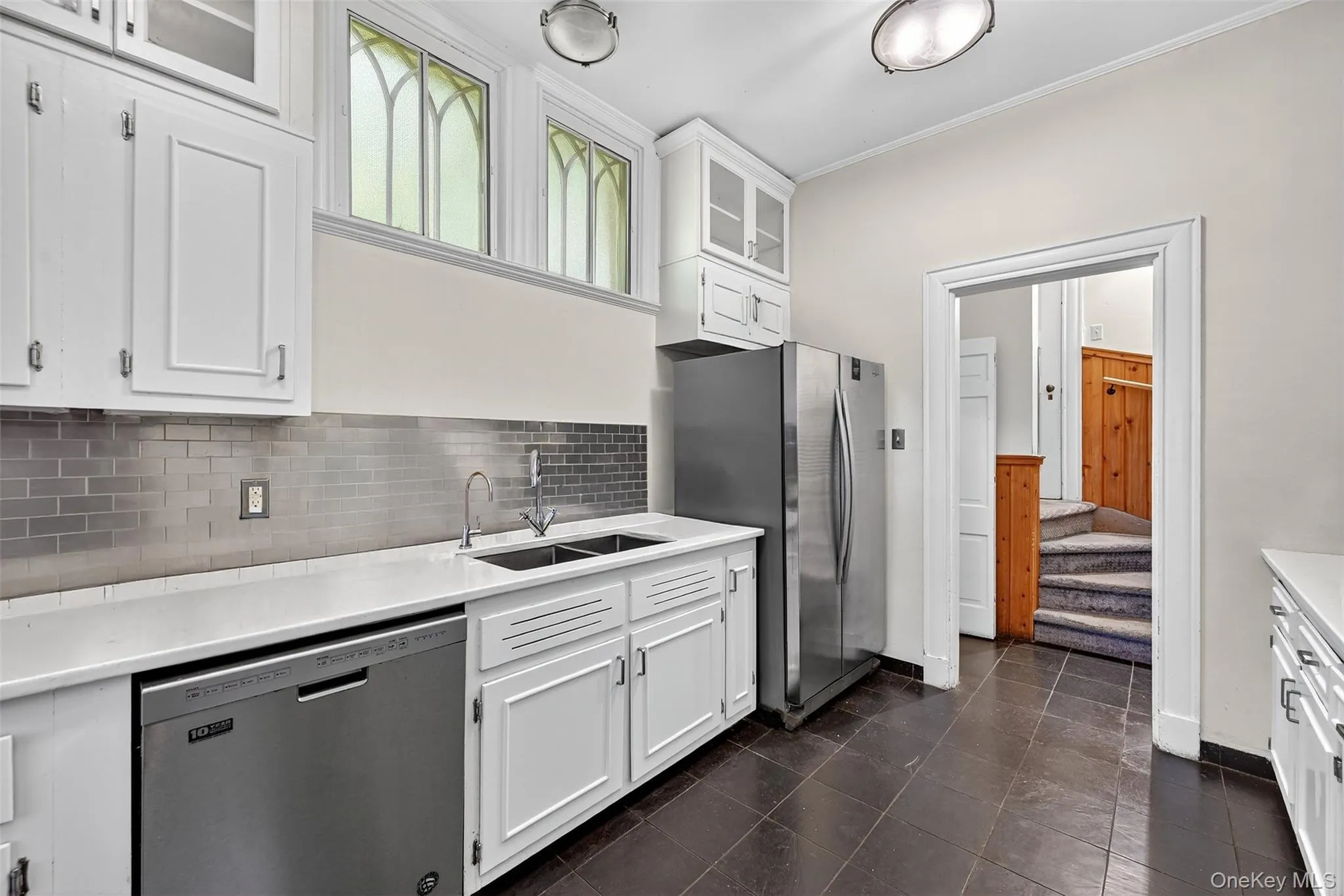 Working kitchen with stainless steel appliances, high ceilings, a back staircase and also leads directly to the dining room. There's a side entry as well. Working kitchen with stainless steel appliances, high ceilings, a back staircase and also leads directly to the dining room. There's a side entry as well.