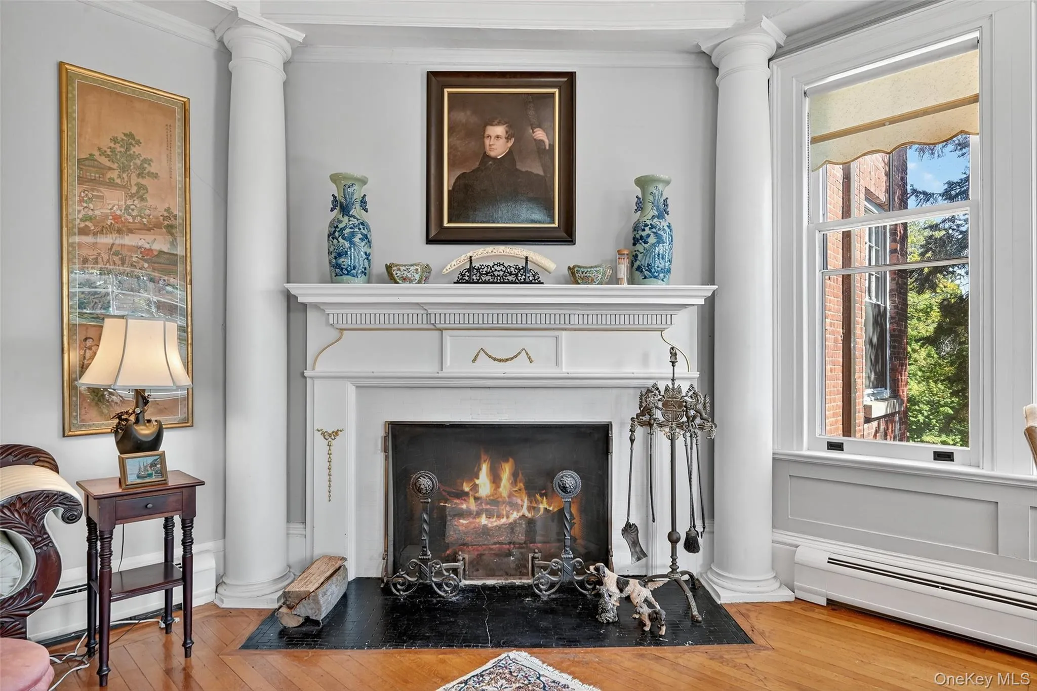 A close up of the fireplace with unique architectural surround. A close up of the fireplace with unique architectural surround.