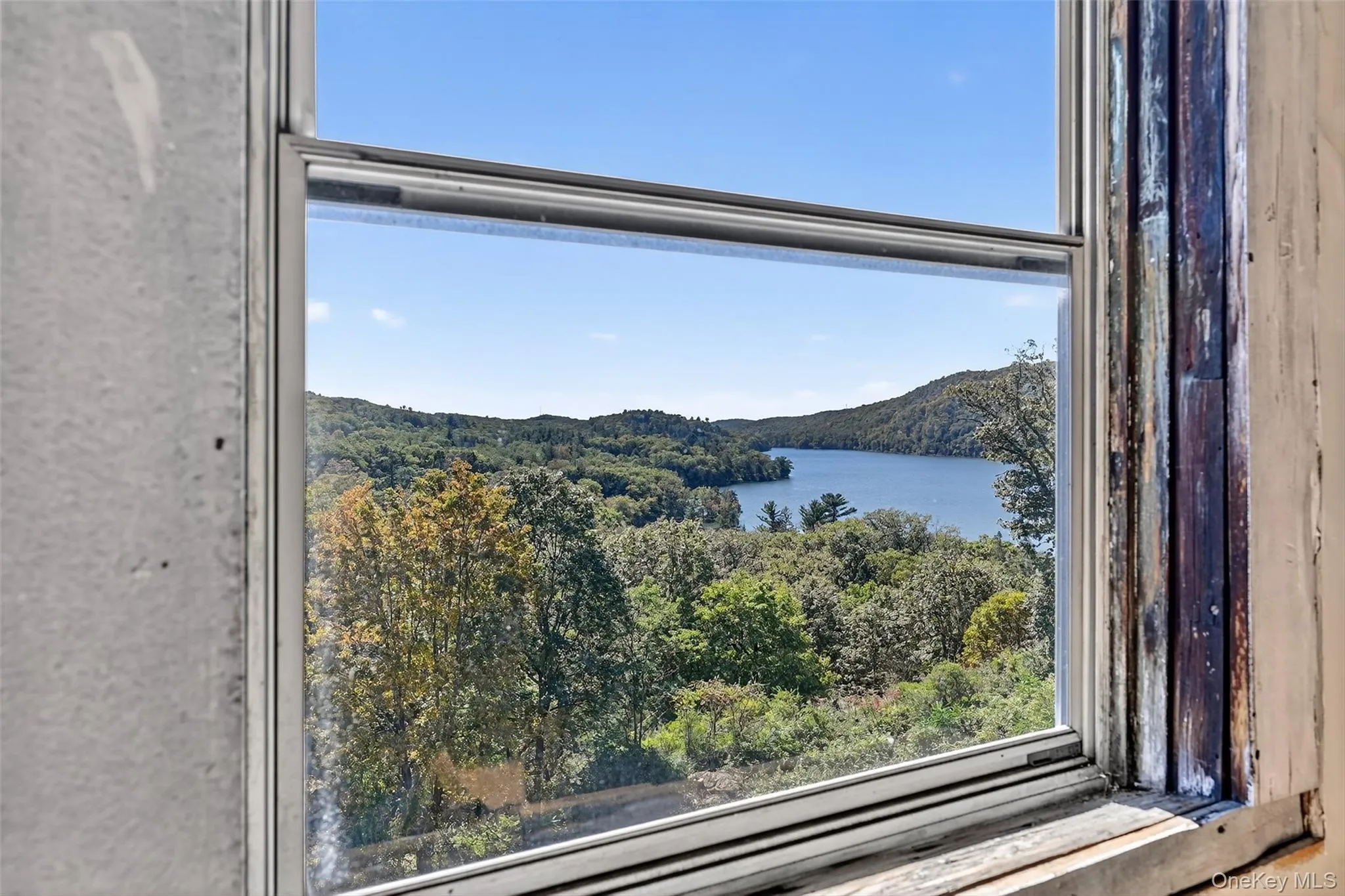 Top level of home offers astounding scenic views of the lake. This level is mid-renovation and is perfect for reimagined spaces. Top level of home offers astounding scenic views of the lake. This level is mid-renovation and is perfect for reimagined spaces.