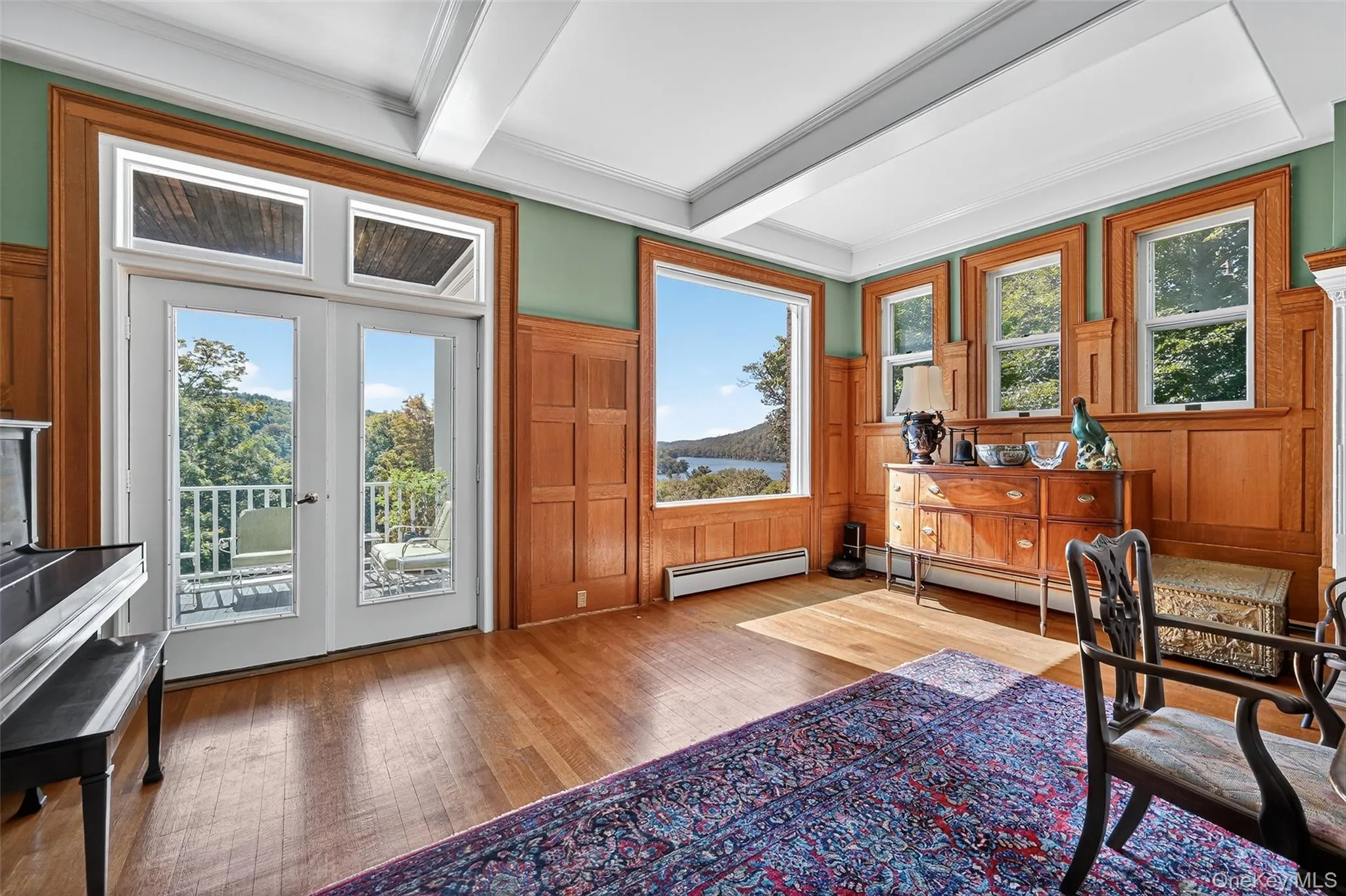 Dining room boasts abundant natural light from the South and West, and features restored wood paneling. Dining room boasts abundant natural light from the South and West, and features restored wood paneling.