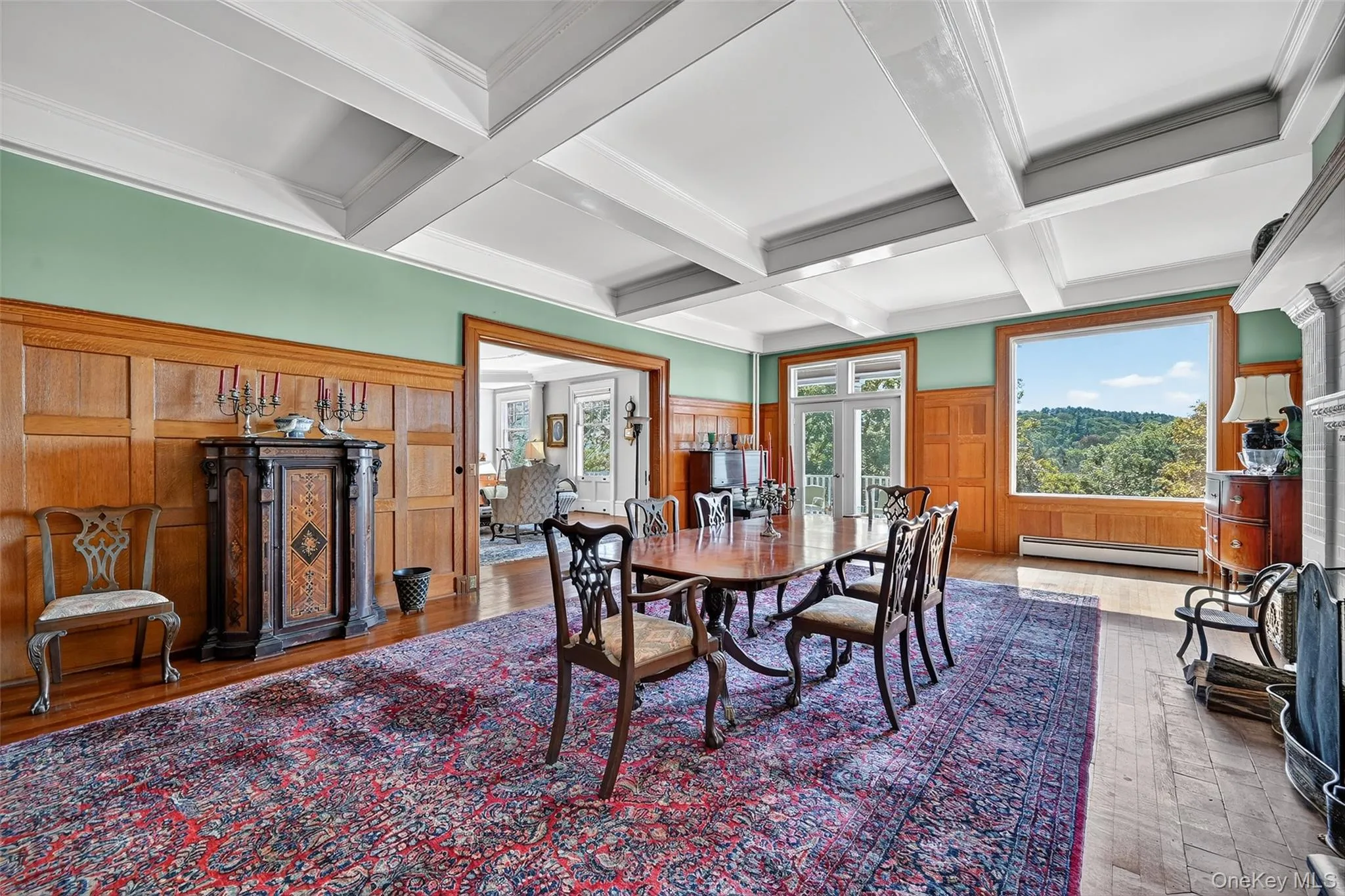 Dining room boasts abundant natural light from the South and West, and features restored wood paneling. Dining room boasts abundant natural light from the South and West, and features restored wood paneling.