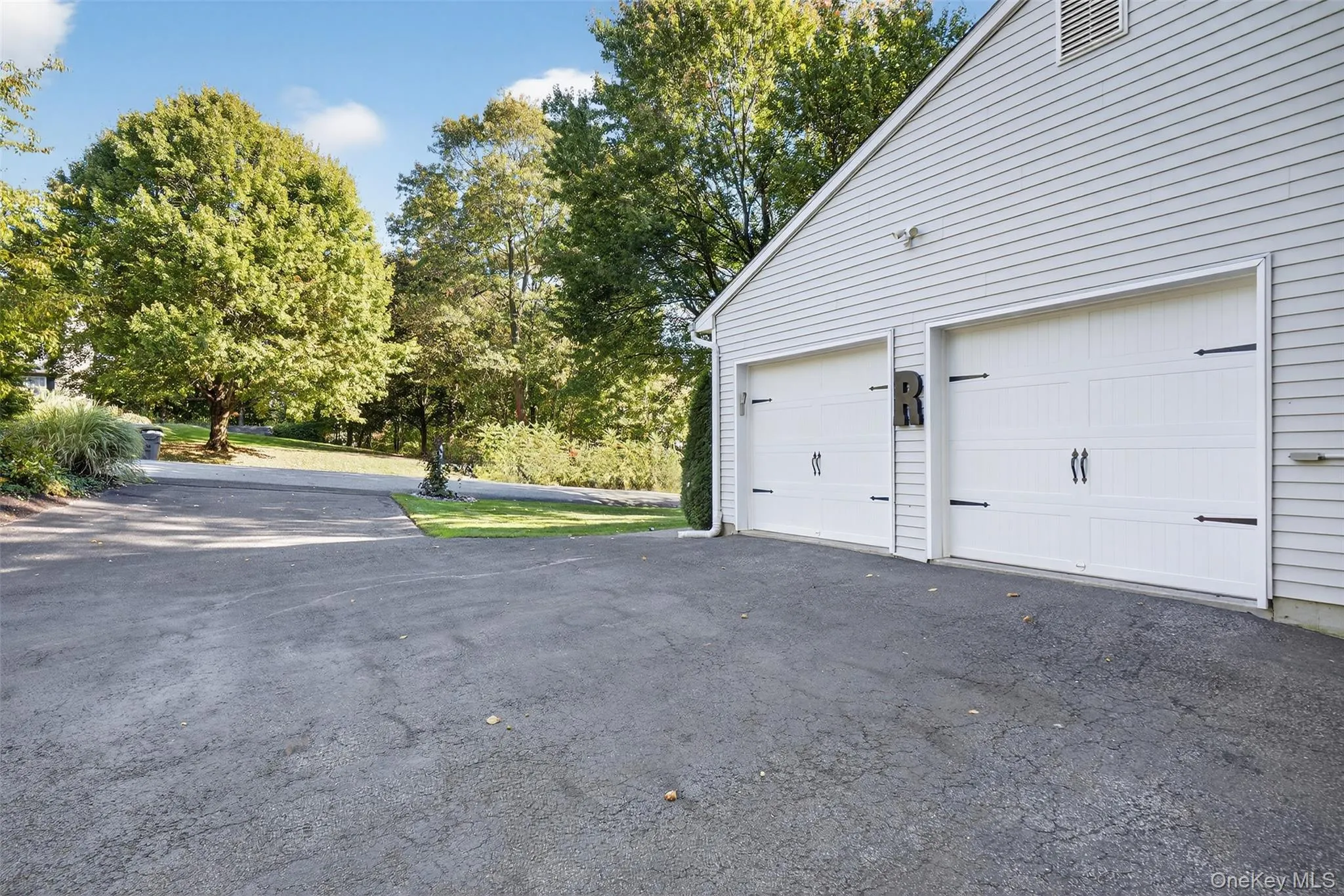 Garage with asphalt driveway Garage with asphalt driveway