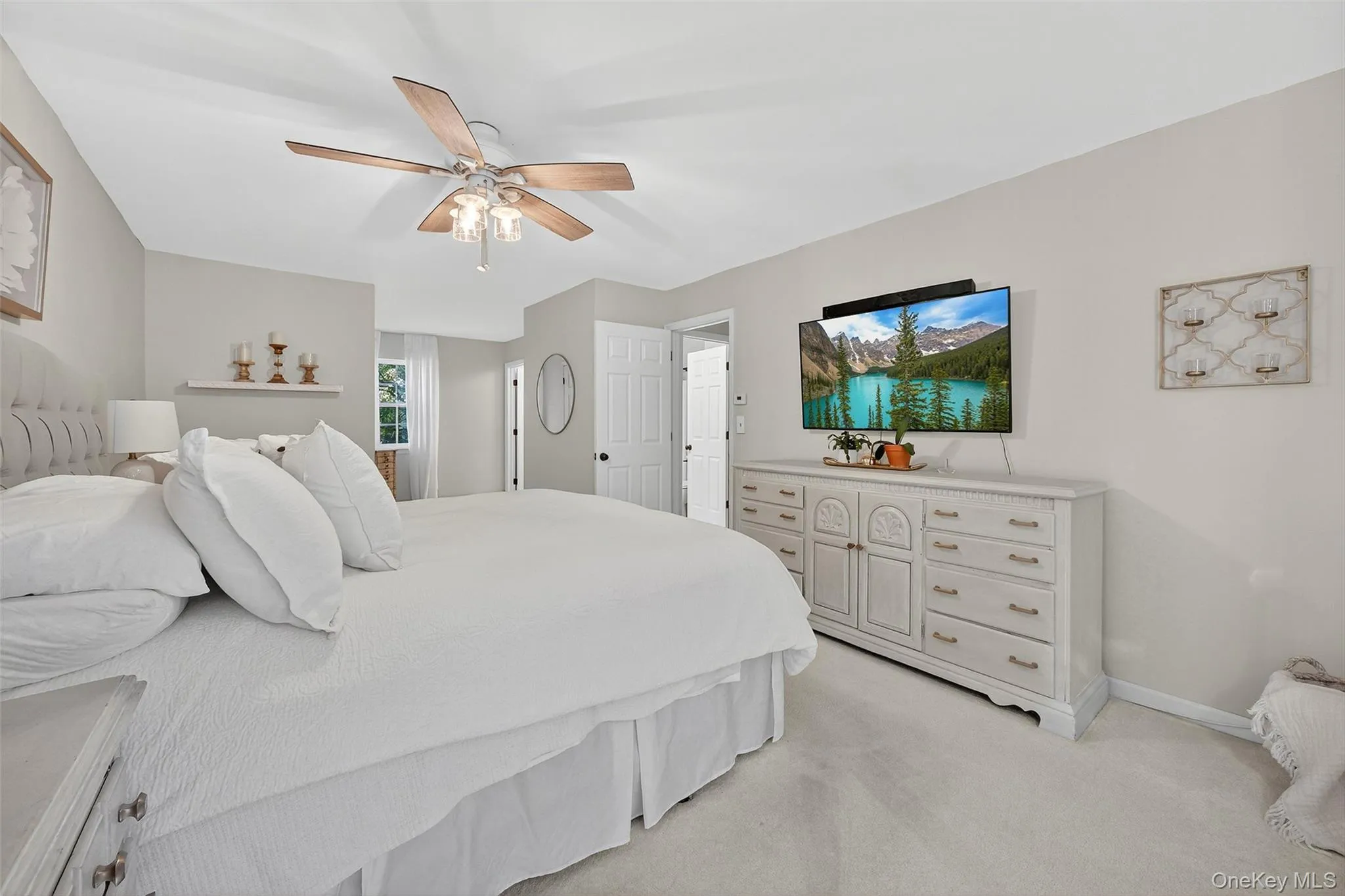 Bedroom with light carpet and ceiling fan Bedroom with light carpet and ceiling fan