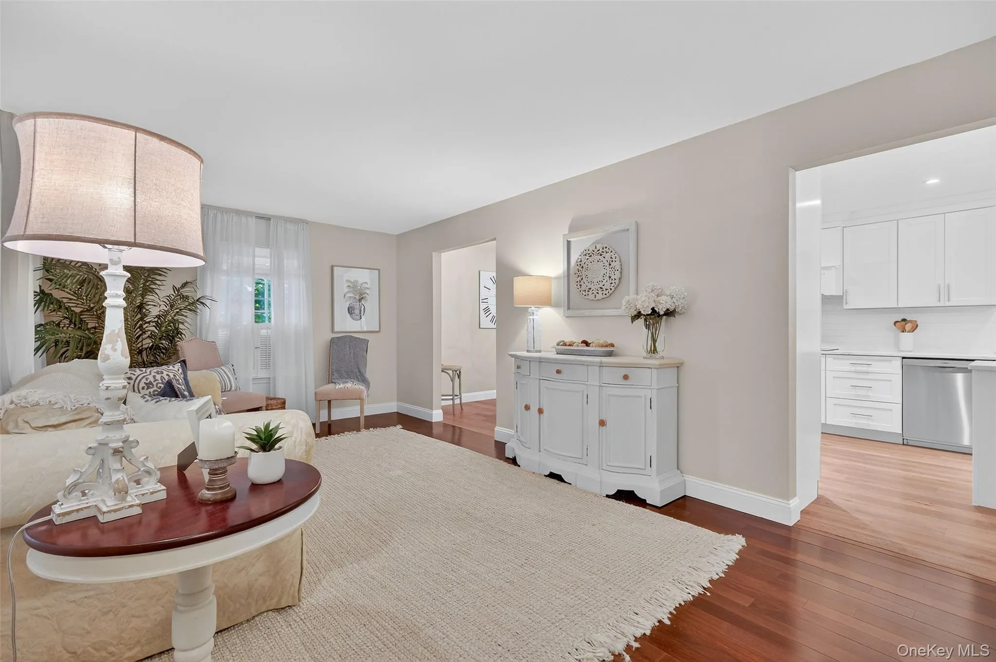 Living room with dark wood-style floors and baseboards Living room with dark wood-style floors and baseboards