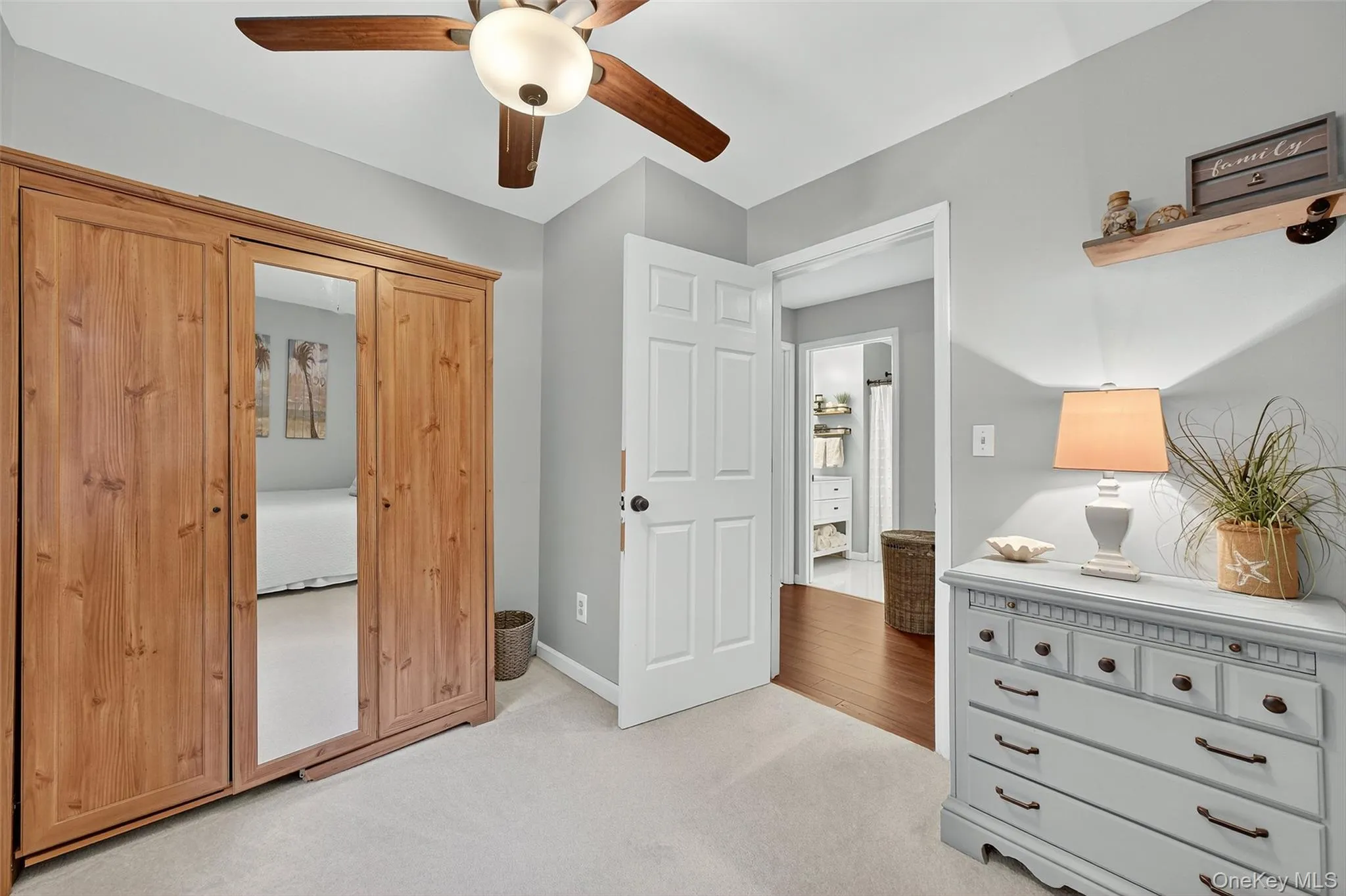 Bedroom with light colored carpet and ceiling fan Bedroom with light colored carpet and ceiling fan