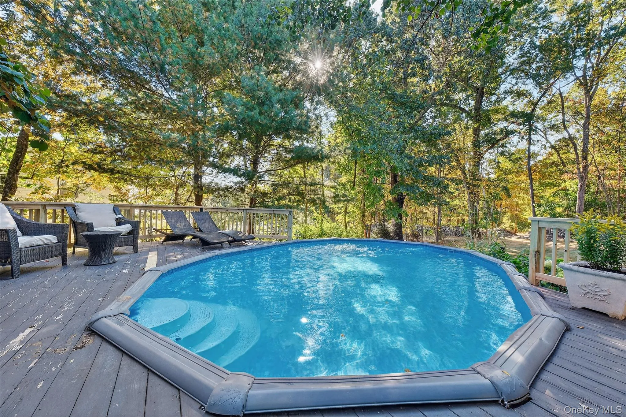 Outdoor pool featuring a wooden deck Outdoor pool featuring a wooden deck