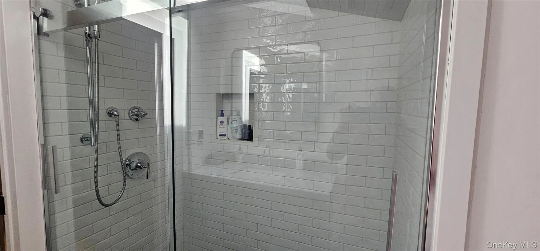 Bathroom with a shower stall Bathroom with a shower stall