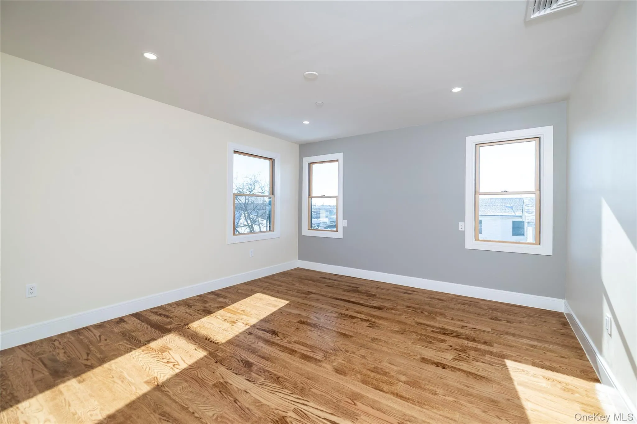 Primary room featuring light wood-type flooring and recessed lighting Primary room featuring light wood-type flooring and recessed lighting