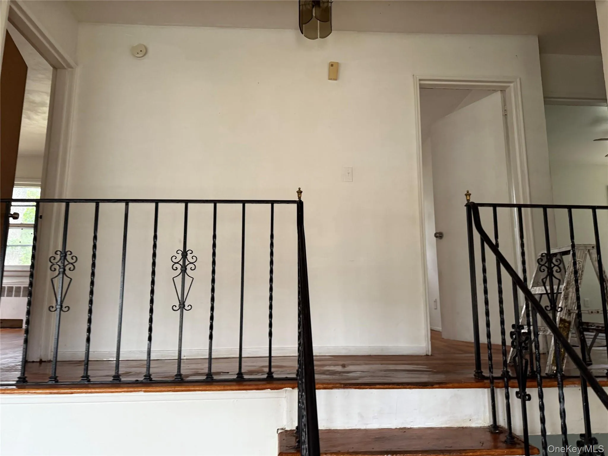 Stairway with wood finished floors and baseboards Stairway with wood finished floors and baseboards