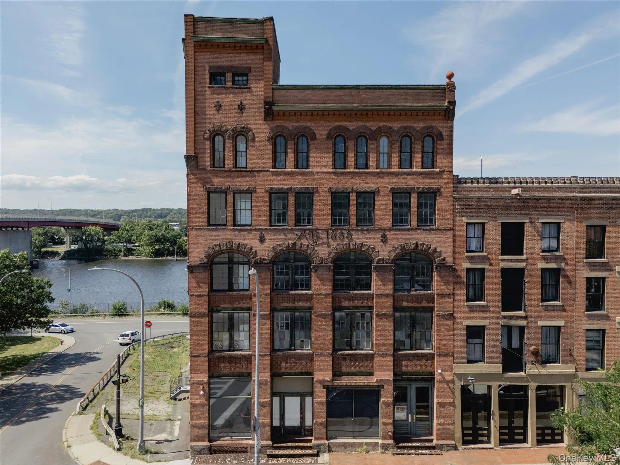 View of apartment building / complex with a water view View of apartment building / complex with a water view