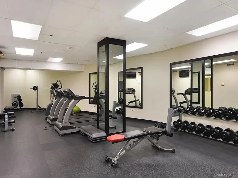 Gym featuring a drop ceiling Gym featuring a drop ceiling