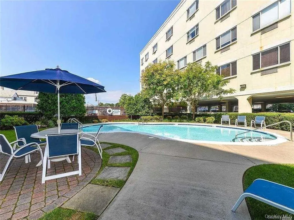 Community pool with a patio Community pool with a patio