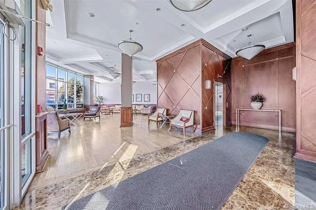 Building lobby with coffered ceiling, beam ceiling, and crown molding Building lobby with coffered ceiling, beam ceiling, and crown molding