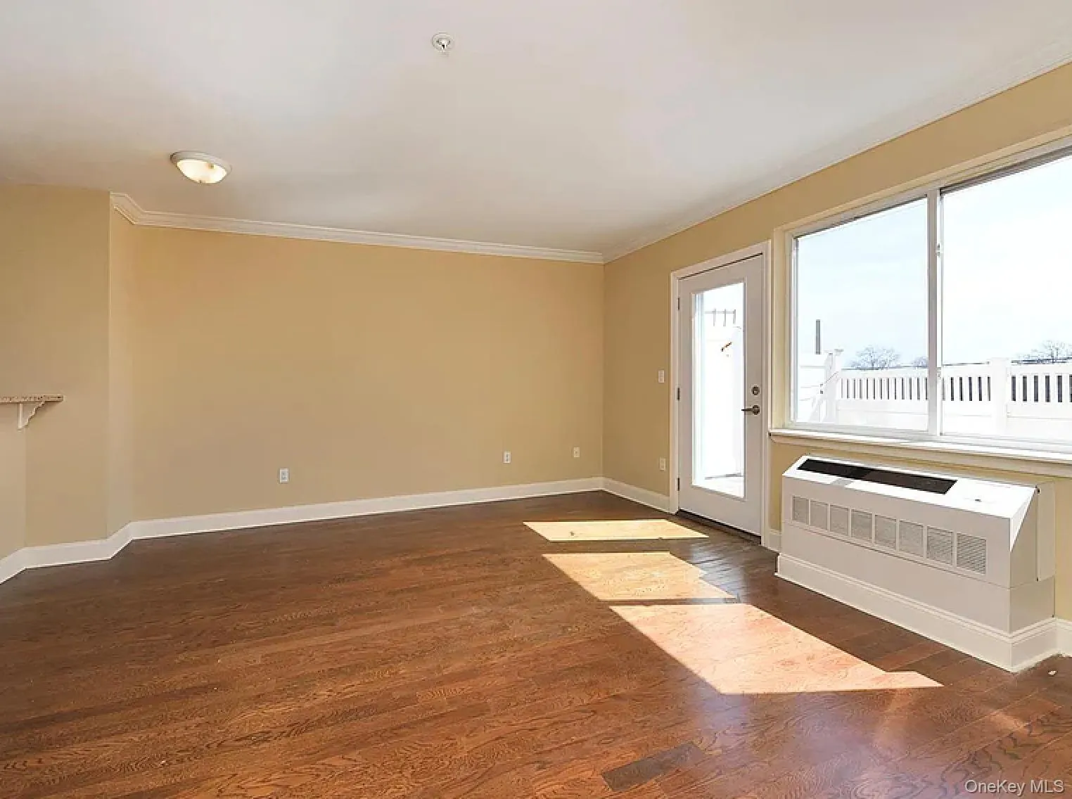 Foyer featuring dark wood-style floors and crown molding Foyer featuring dark wood-style floors and crown molding