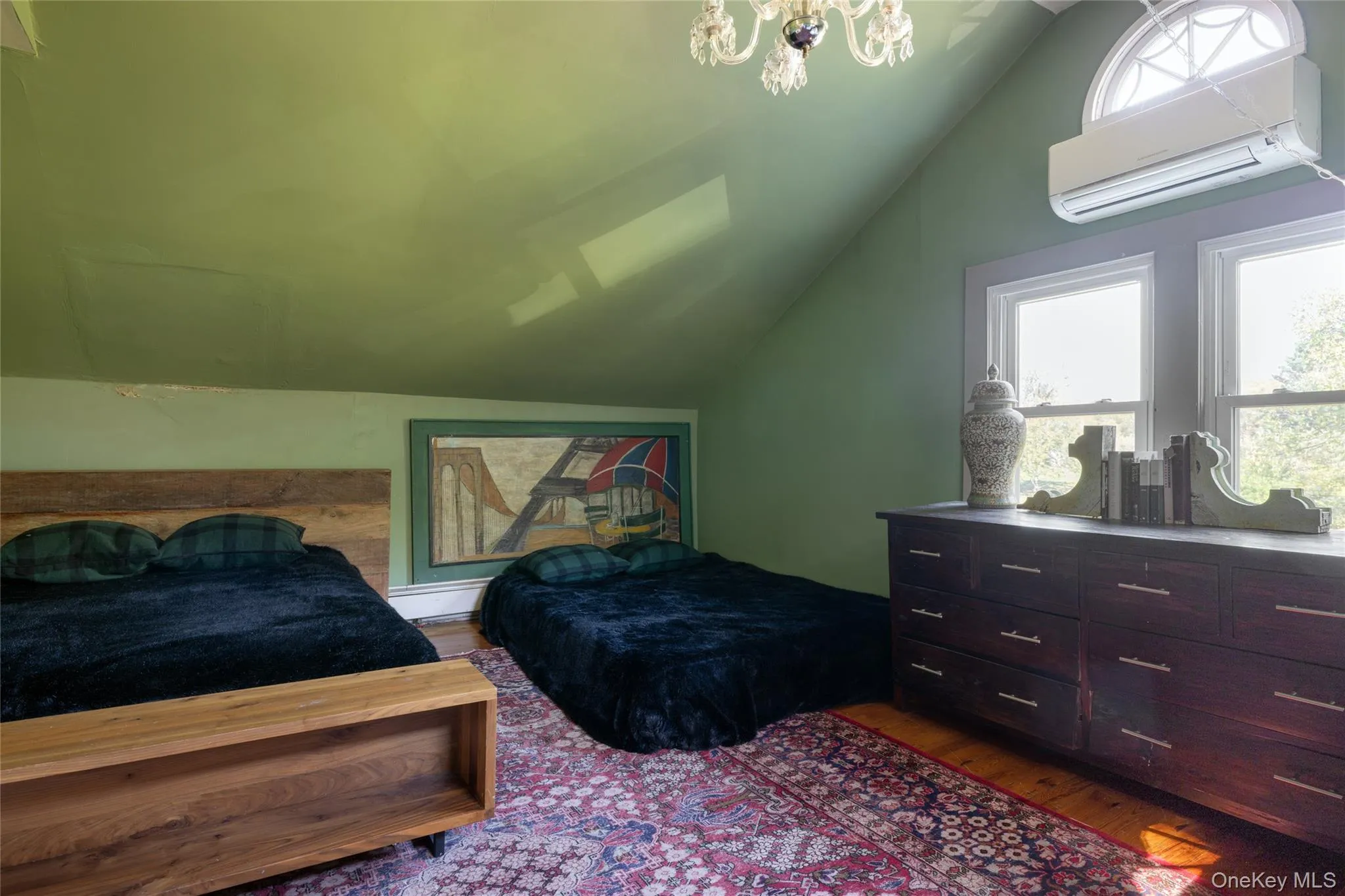 Bedroom featuring lofted ceiling Bedroom featuring lofted ceiling
