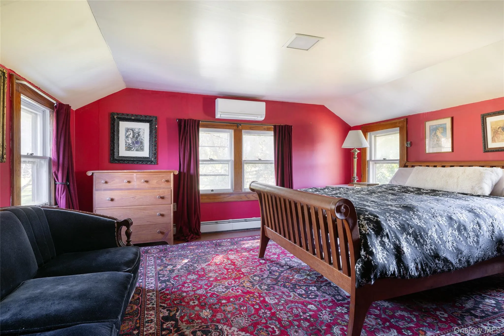 Bedroom featuring lofted ceiling Bedroom featuring lofted ceiling