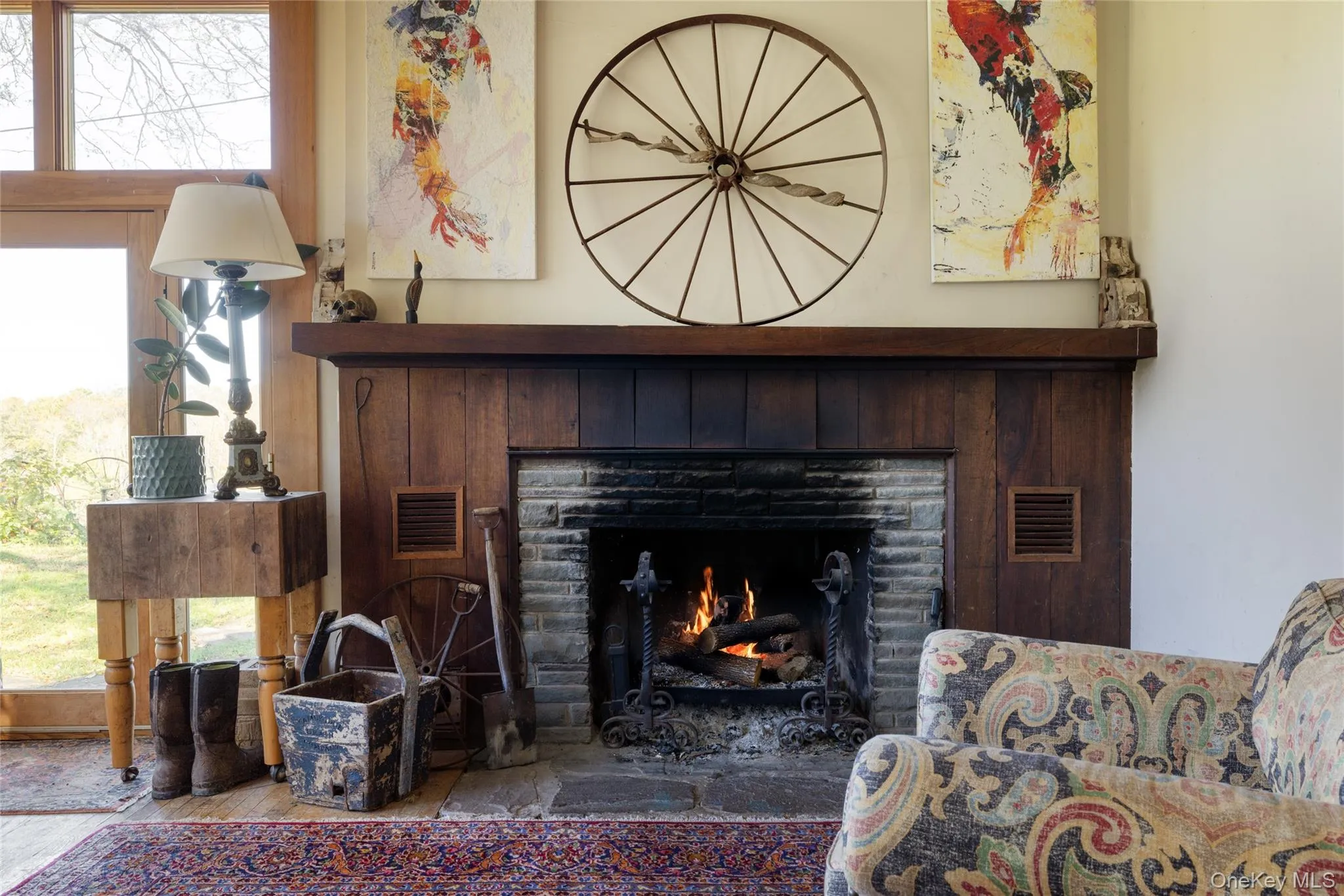 Living room a fireplace and wood finished floors Living room a fireplace and wood finished floors