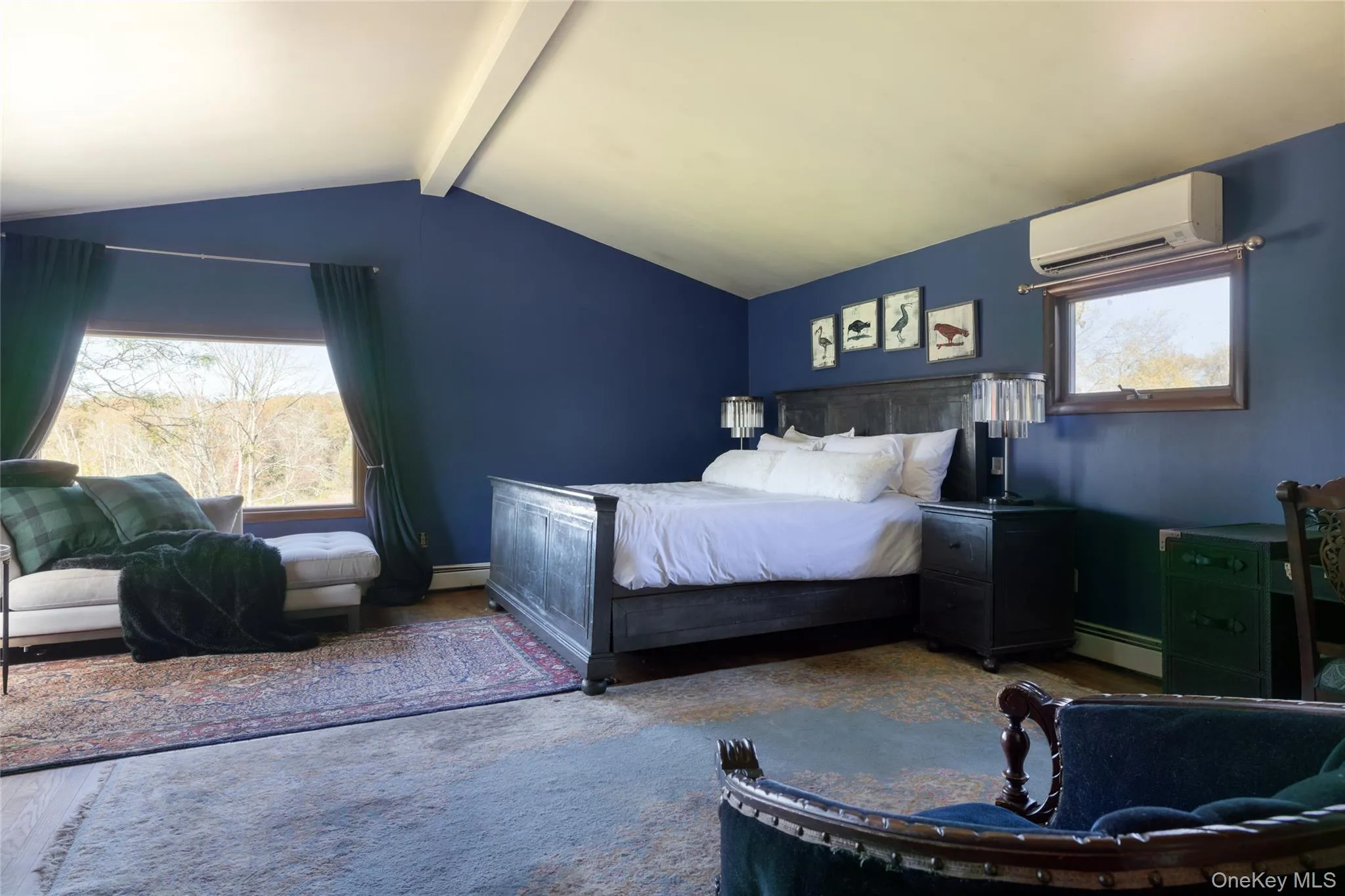 Primary bedroom with wood floors Primary bedroom with wood floors