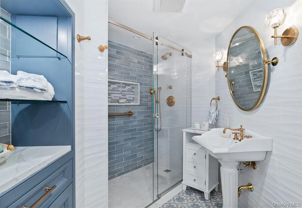 View of the the ensuite bathroom located in the guest bedroom suite. View of the the ensuite bathroom located in the guest bedroom suite.
