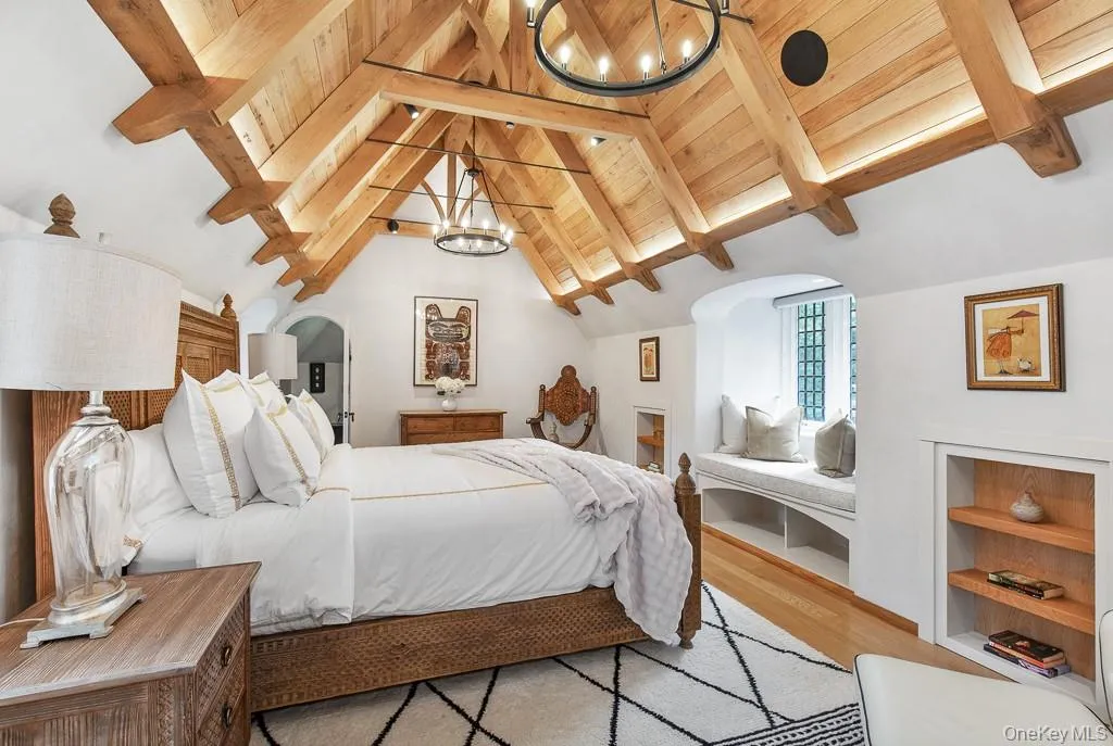 Spectacular primary bedroom suite with vaulted white oak beam ceiling detail. Spectacular primary bedroom suite with vaulted white oak beam ceiling detail.